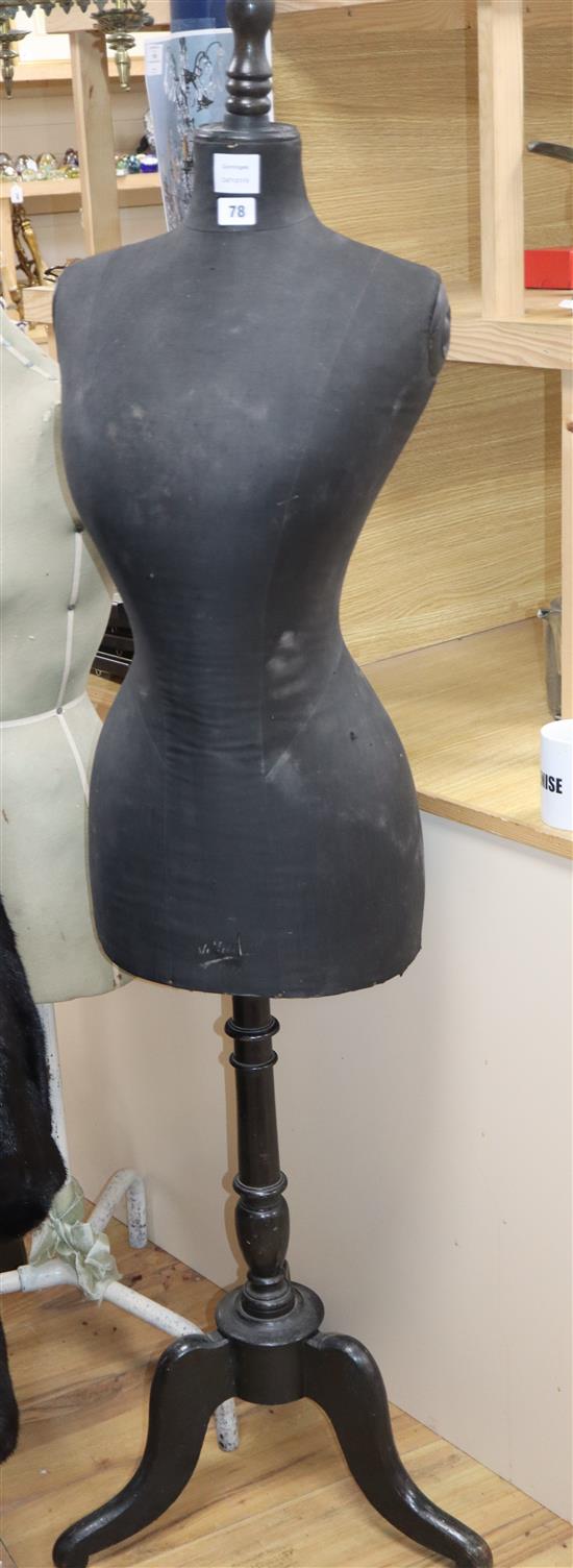 A dress makers dummy, on tripod base